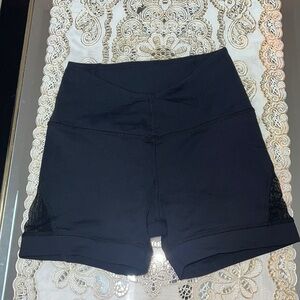 Karma black booty shorts with mesh inserts